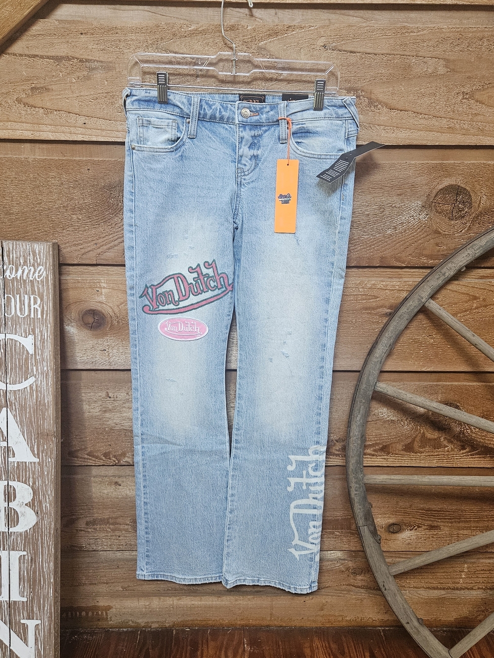 Light Blue Women's Jeans with Pink Logo Patch
